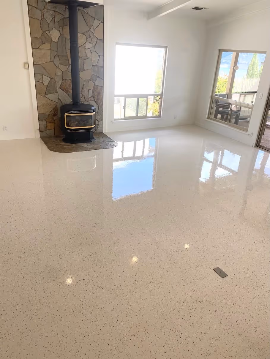 Polished tile in a great room, cleaned around the wood stove