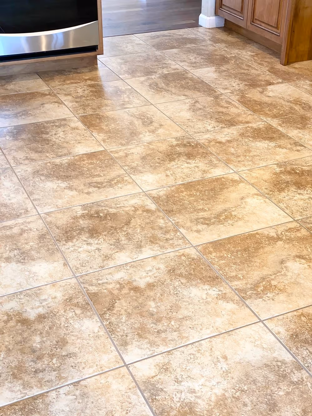 Large-format travertine tile after cleaning and sealing